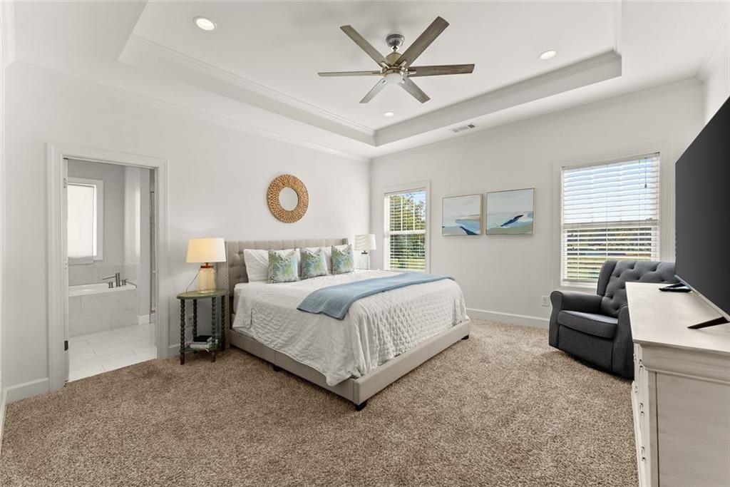 360 Clear View Court Clermont, GA 30527 - Photo 24 of 53 a bedroom with a bed couch and window