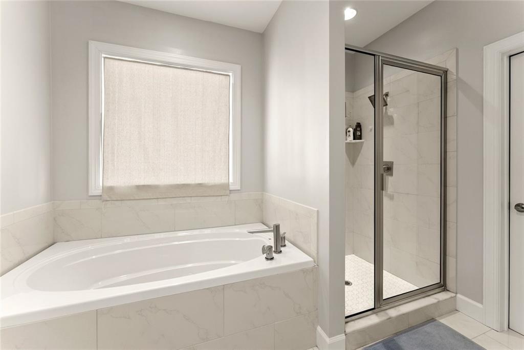 360 Clear View Court Clermont, GA 30527 - Photo 27 of 53 a white bath tub sitting next to a shower