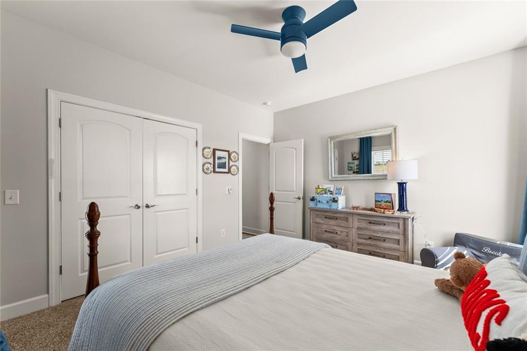 360 Clear View Court Clermont, GA 30527 - Photo 30 of 53 a bedroom with a bed and a dresser