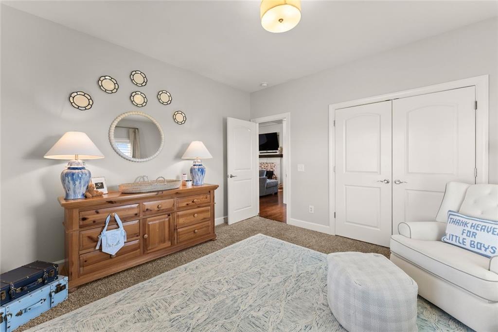 360 Clear View Court Clermont, GA 30527 - Photo 33 of 53 a spacious bathroom with a granite countertop sink and a mirror