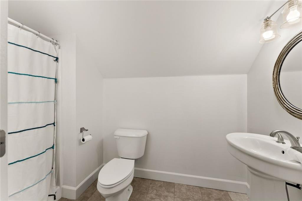 360 Clear View Court Clermont, GA 30527 - Photo 37 of 53 a white toilet sitting next to a bathroom sink