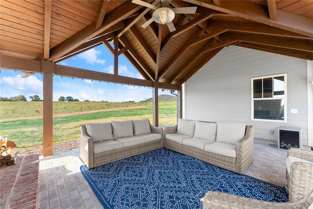 360 Clear View Court Clermont, GA 30527 - Photo 41 of 53 a living room with furniture and floor to ceiling windows