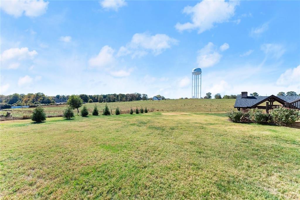 360 Clear View Court Clermont, GA 30527 - Photo 44 of 53 a view of a large body of water with a building in the background