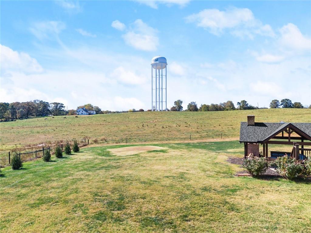 360 Clear View Court Clermont, GA 30527 - Photo 52 of 53 a view of a lake with table and chairs next to an ocean