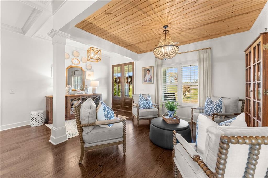 360 Clear View Court Clermont, GA 30527 - Photo 8 of 53 a living room with furniture chandelier and wooden floor