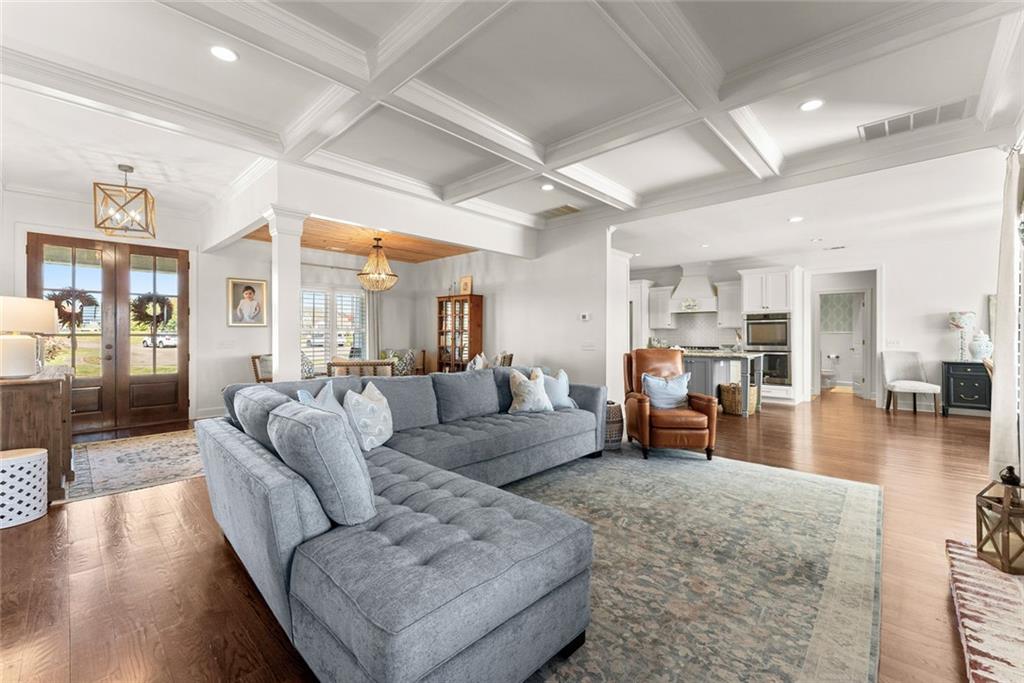360 Clear View Court Clermont, GA 30527 - Photo 9 of 53 a living room with furniture and a wooden floor