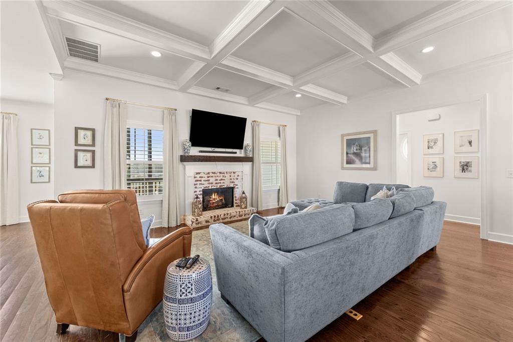 360 Clear View Court Clermont, GA 30527 - Photo 10 of 53 a living room with furniture a fireplace and a flat screen tv
