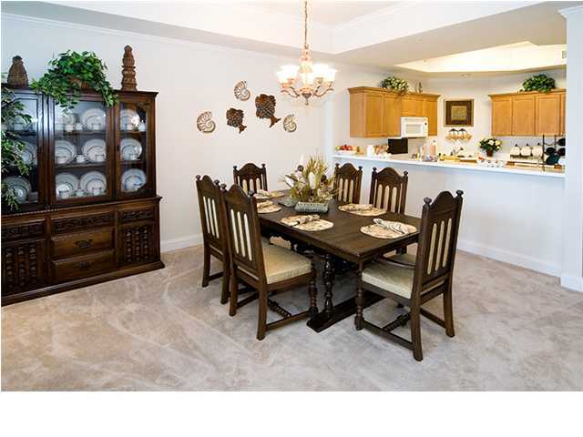 5 Calhoun Avenue, Unit 606 Destin, FL 32541 - Photo 13 of 18 a dining room with furniture and window