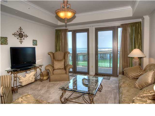 5 Calhoun Avenue, Unit 606 Destin, FL 32541 - Photo 3 of 18 a living room with furniture and a flat screen tv