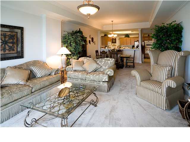 5 Calhoun Avenue, Unit 606 Destin, FL 32541 - Photo 4 of 18 a living room with furniture and a couch