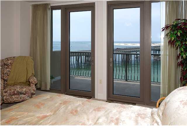 5 Calhoun Avenue, Unit 606 Destin, FL 32541 - Photo 9 of 18 a bedroom with a bed and a window
