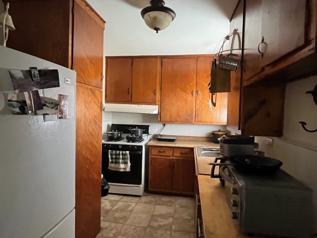 15 County Road 426 Road West Goldthwaite, TX 76844 - Photo 36 of 38 a kitchen with a stove a sink and a refrigerator