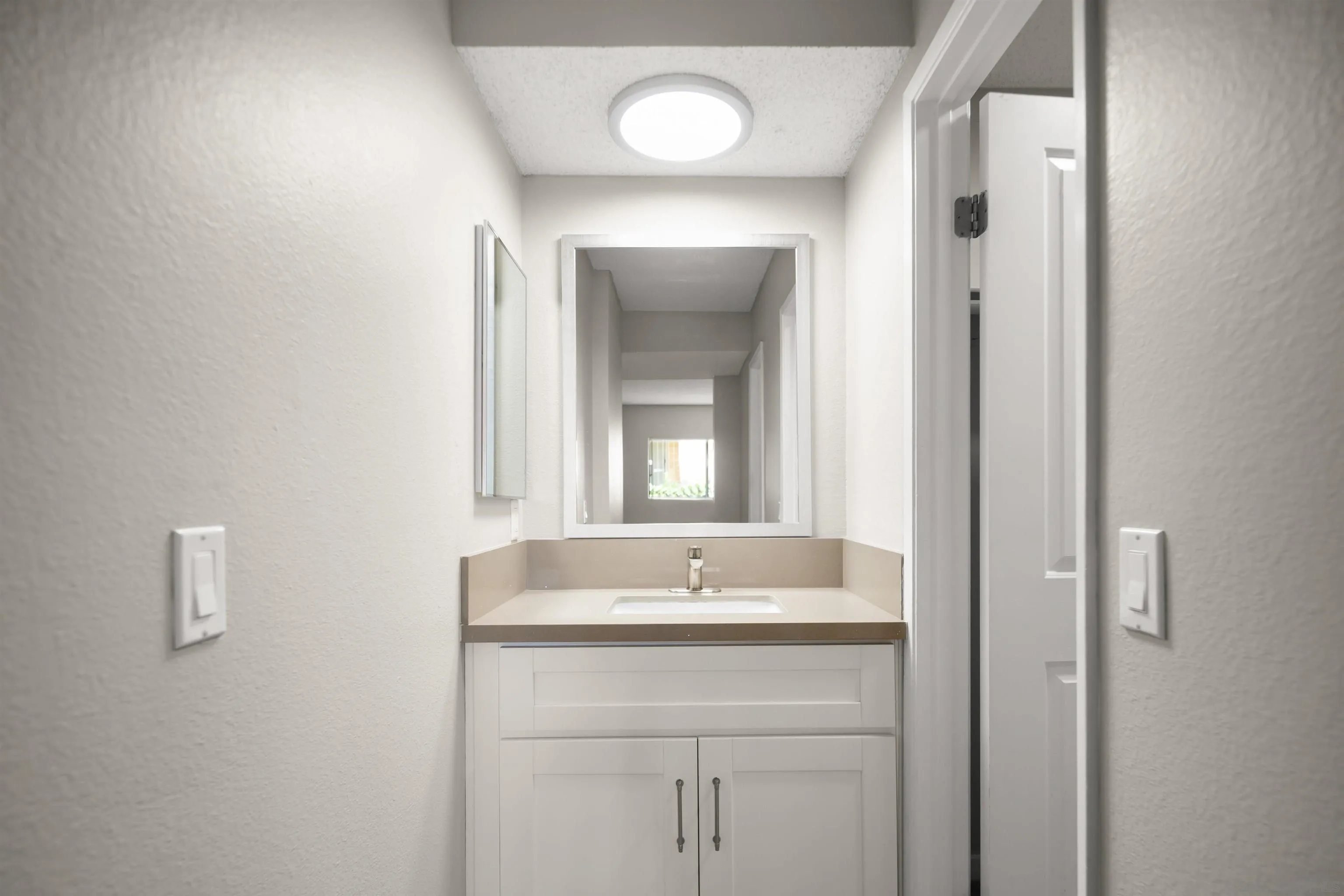 725 Alturas Lane Fallbrook, CA 92028 - Photo 30 of 34 a bathroom with a sink and a mirror