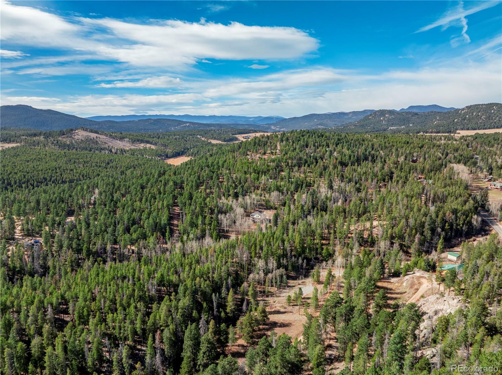 Lot 216620 Indian Springs Road Conifer, CO 80433 - Photo 20 of 37 a view of a city with lush green forest