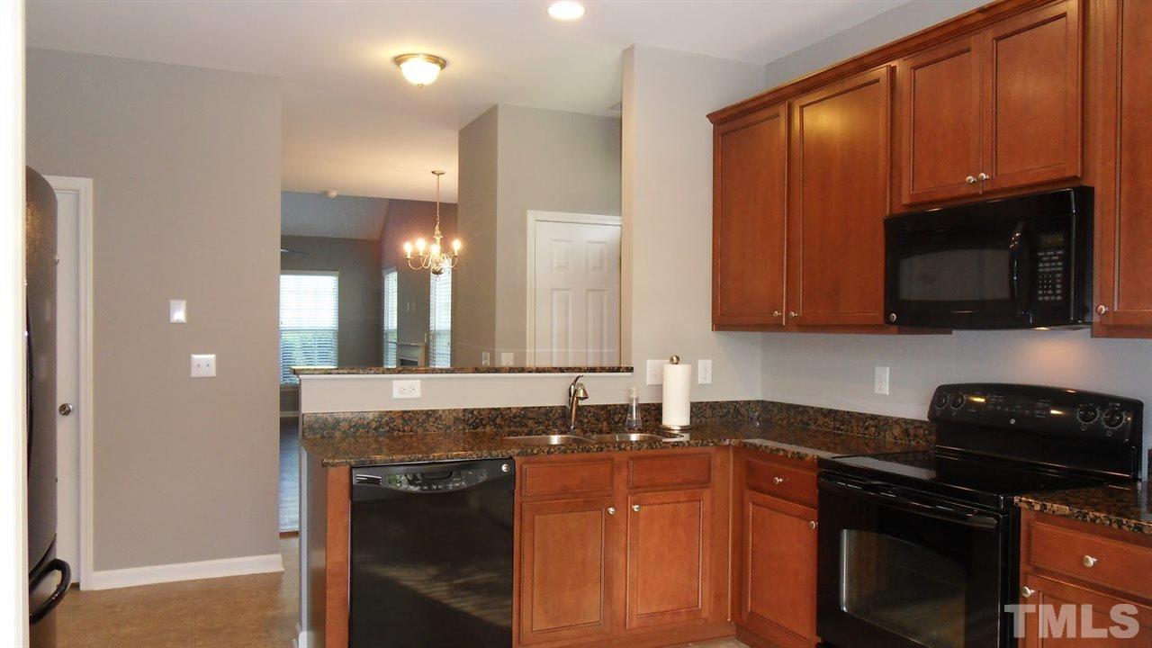 14324 Foxcroft Road Raleigh, NC 27614 - Photo 2 of 25 Sunny kitchen with granite countertops.