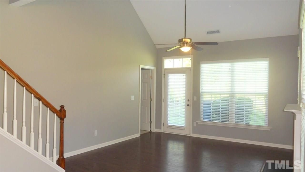 14324 Foxcroft Road Raleigh, NC 27614 - Photo 11 of 25 Living Room with vaulted ceiling, gas fireplace and access to private patio.