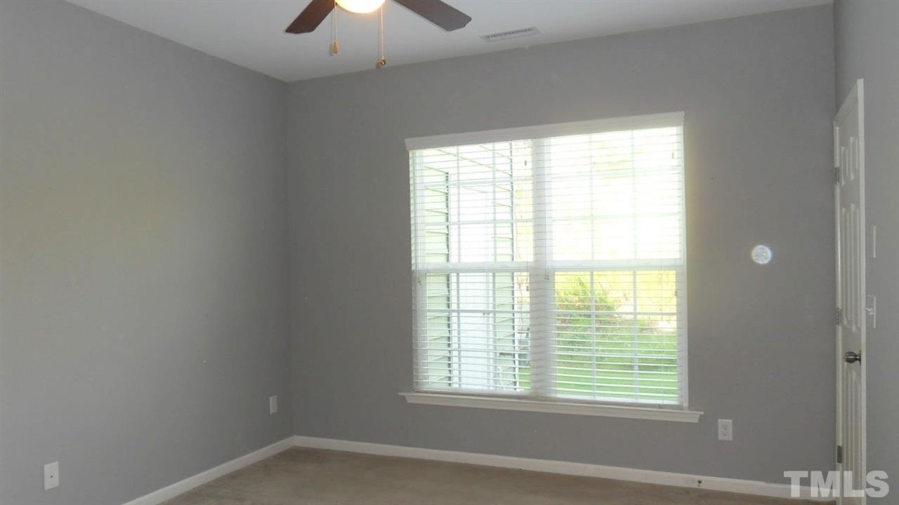 14324 Foxcroft Road Raleigh, NC 27614 - Photo 12 of 25 Master bedroom has a large, walk-in closet and ceiling fan.