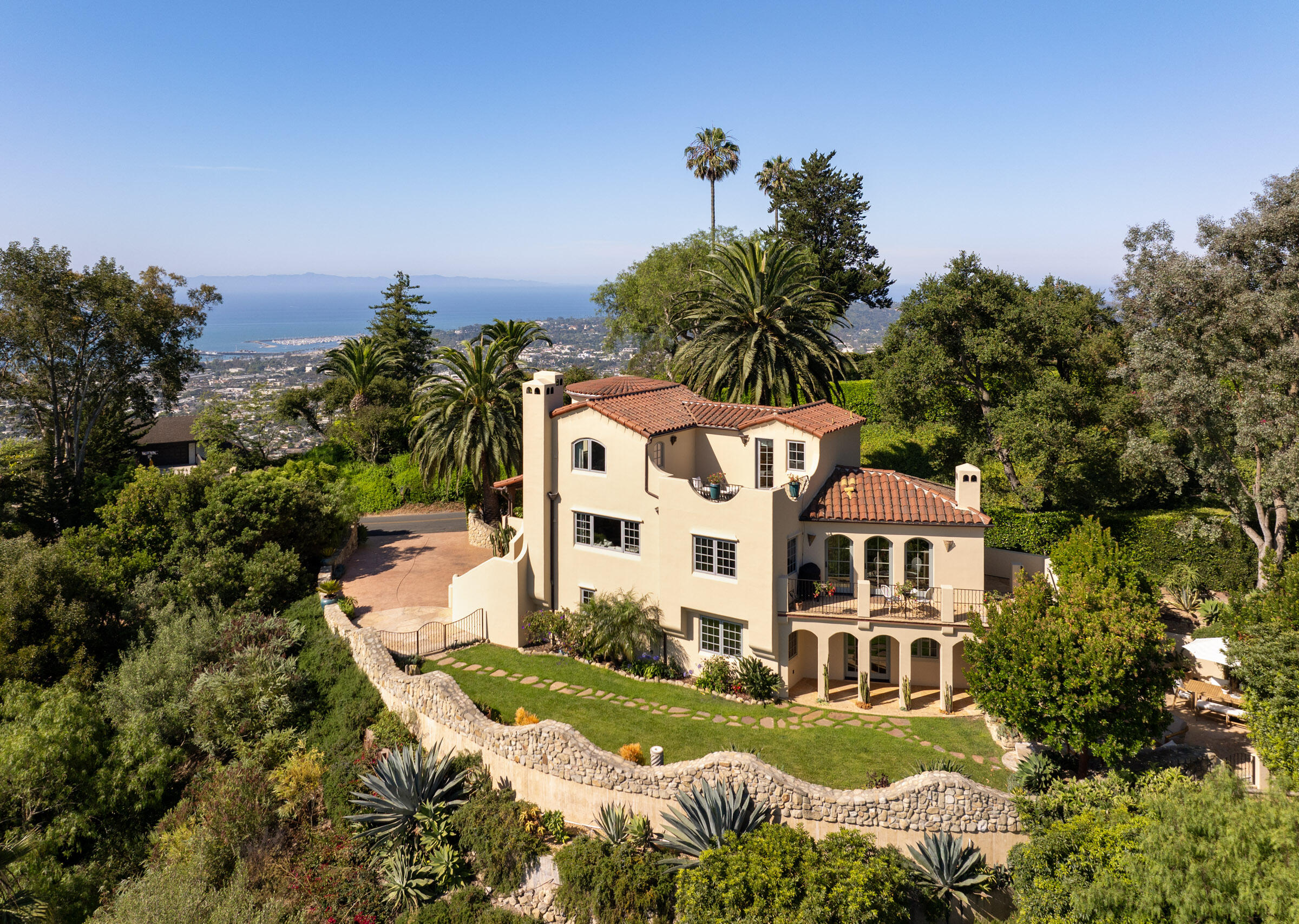 900 Las Alturas Road Santa Barbara, CA 93103 - Photo 1 of 42 a view of a large white building with a yard