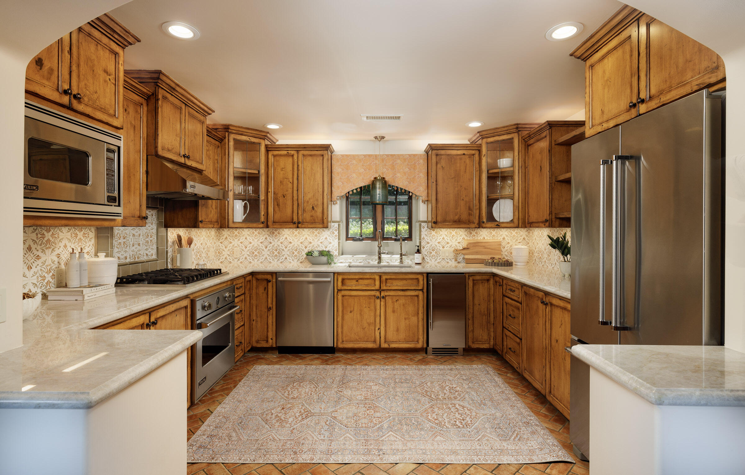 900 Las Alturas Road Santa Barbara, CA 93103 - Photo 16 of 42 a large kitchen with stainless steel appliances granite countertop a sink and cabinets