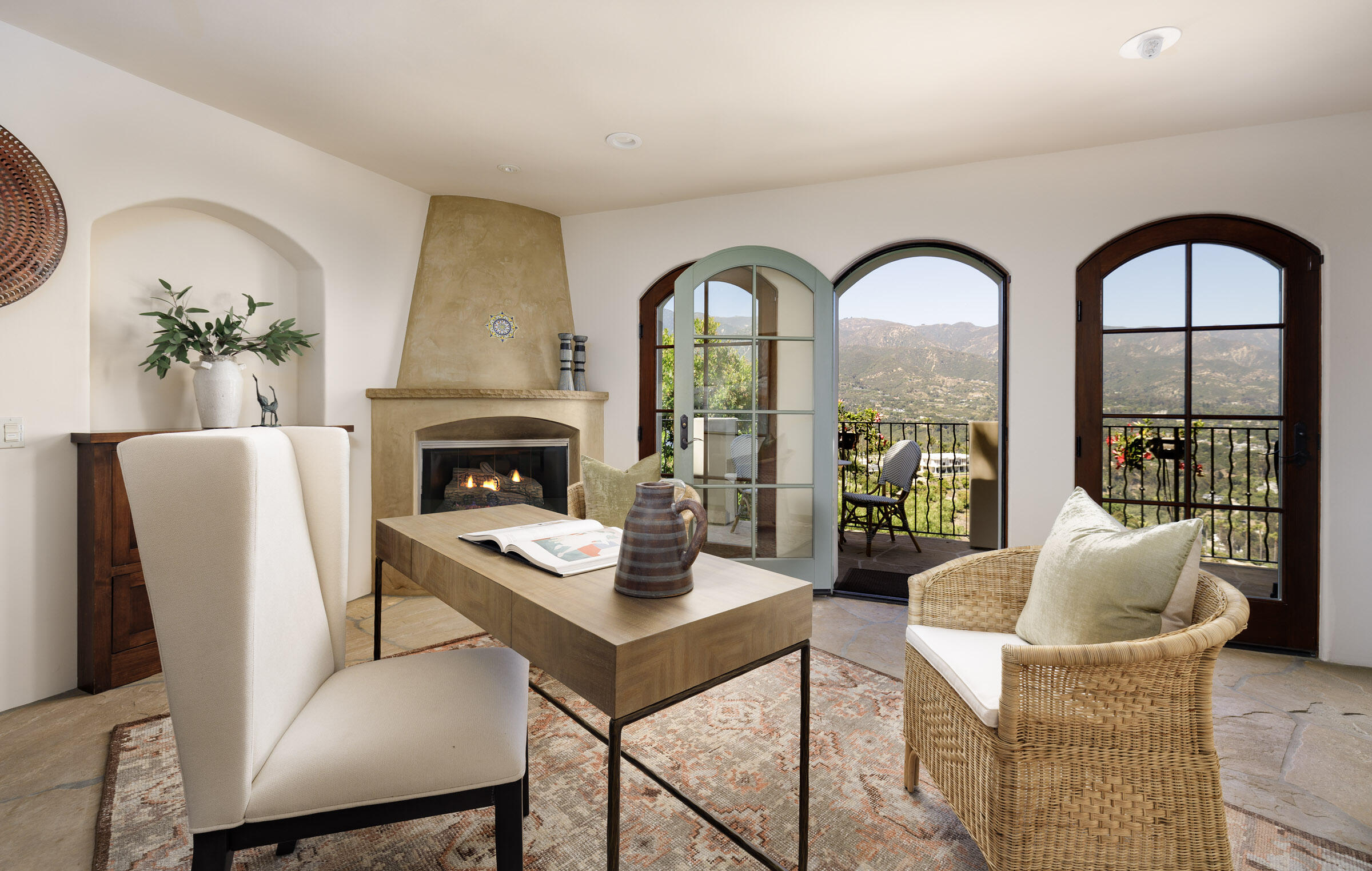 900 Las Alturas Road Santa Barbara, CA 93103 - Photo 19 of 42 a living room with furniture fireplace and potted plants