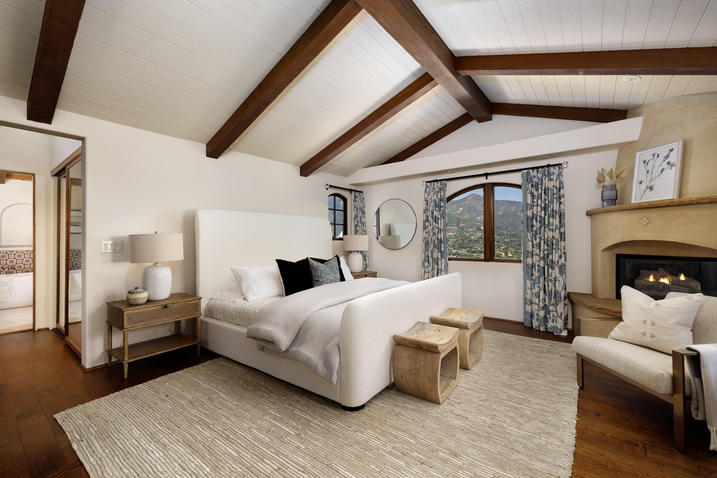 900 Las Alturas Road Santa Barbara, CA 93103 - Photo 21 of 42 a bedroom with furniture and a fireplace