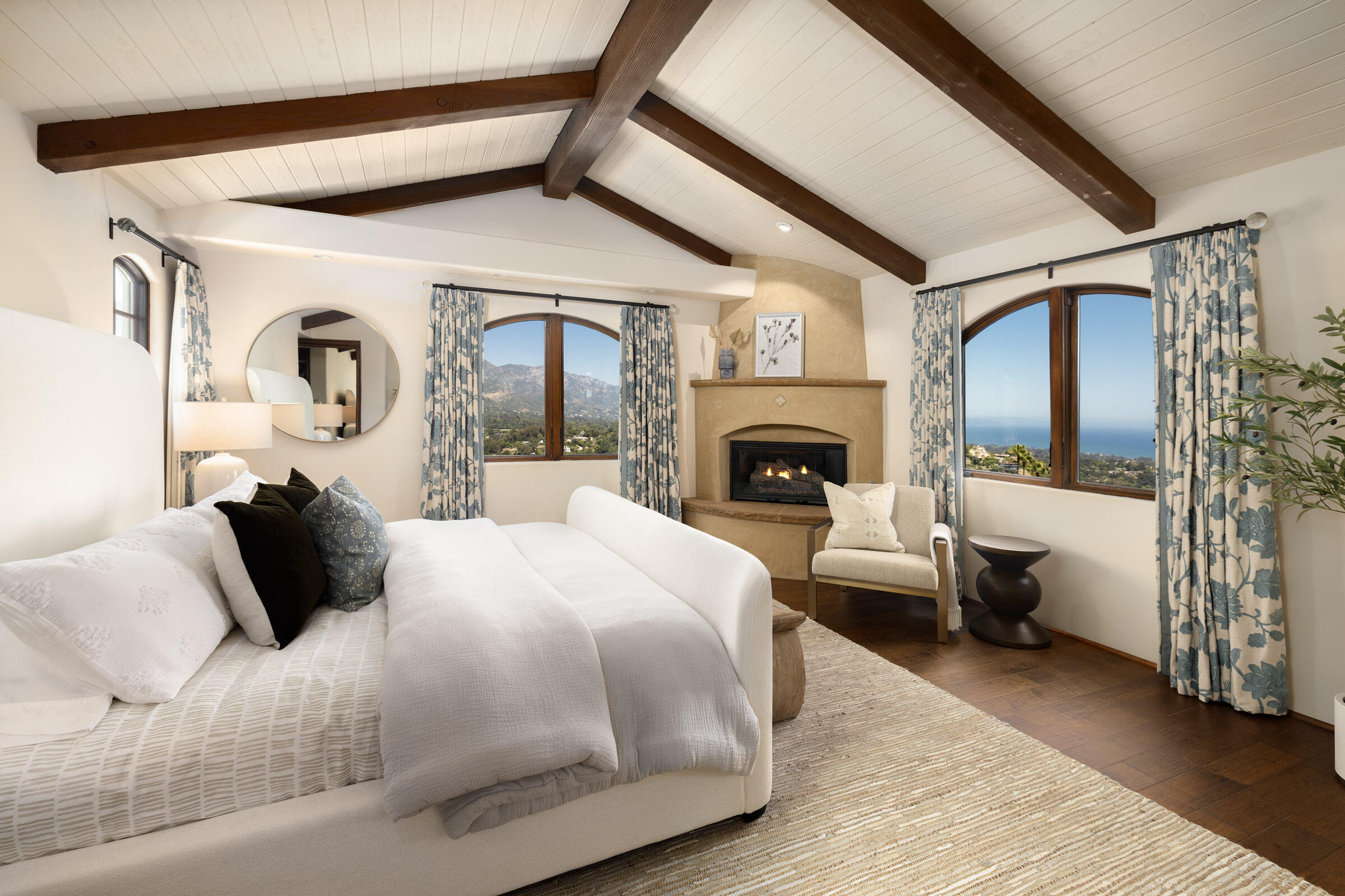 900 Las Alturas Road Santa Barbara, CA 93103 - Photo 22 of 42 a bedroom with a bed and wooden floor