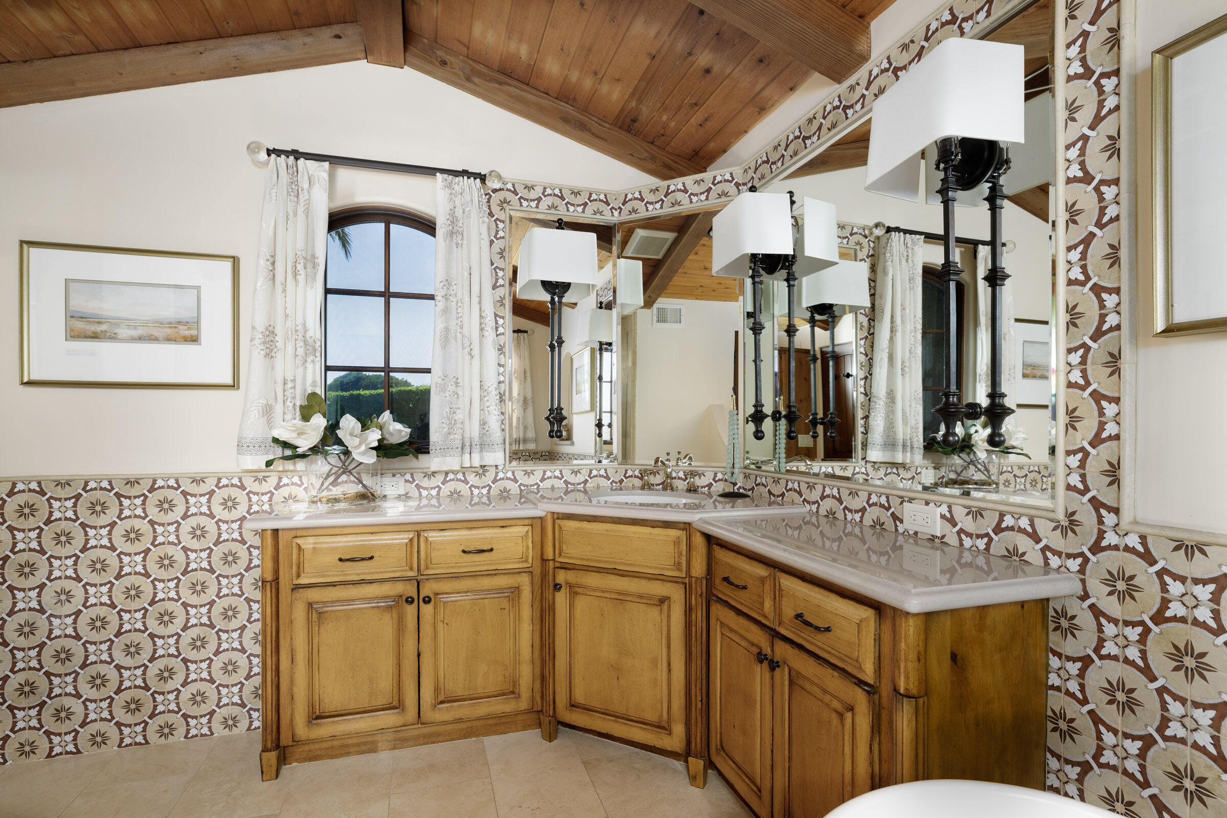 900 Las Alturas Road Santa Barbara, CA 93103 - Photo 23 of 42 a bathroom with a granite countertop sink vanity granite and a mirror