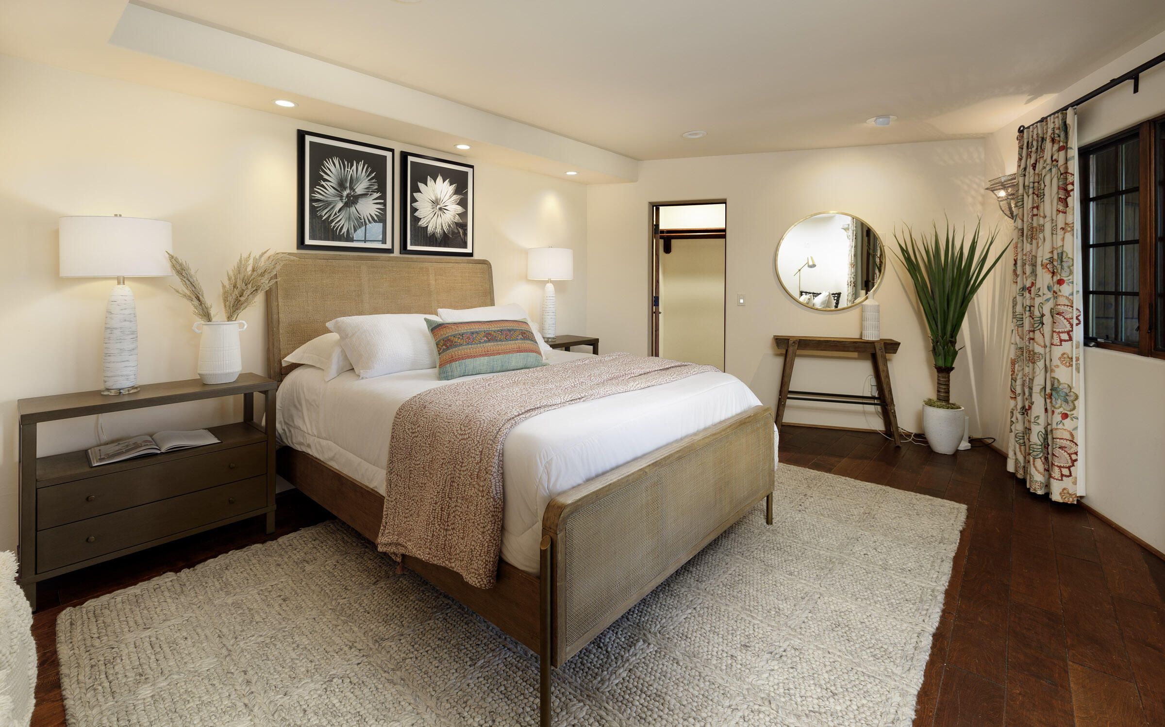 900 Las Alturas Road Santa Barbara, CA 93103 - Photo 30 of 42 a bedroom with a bed and a painting on the wall