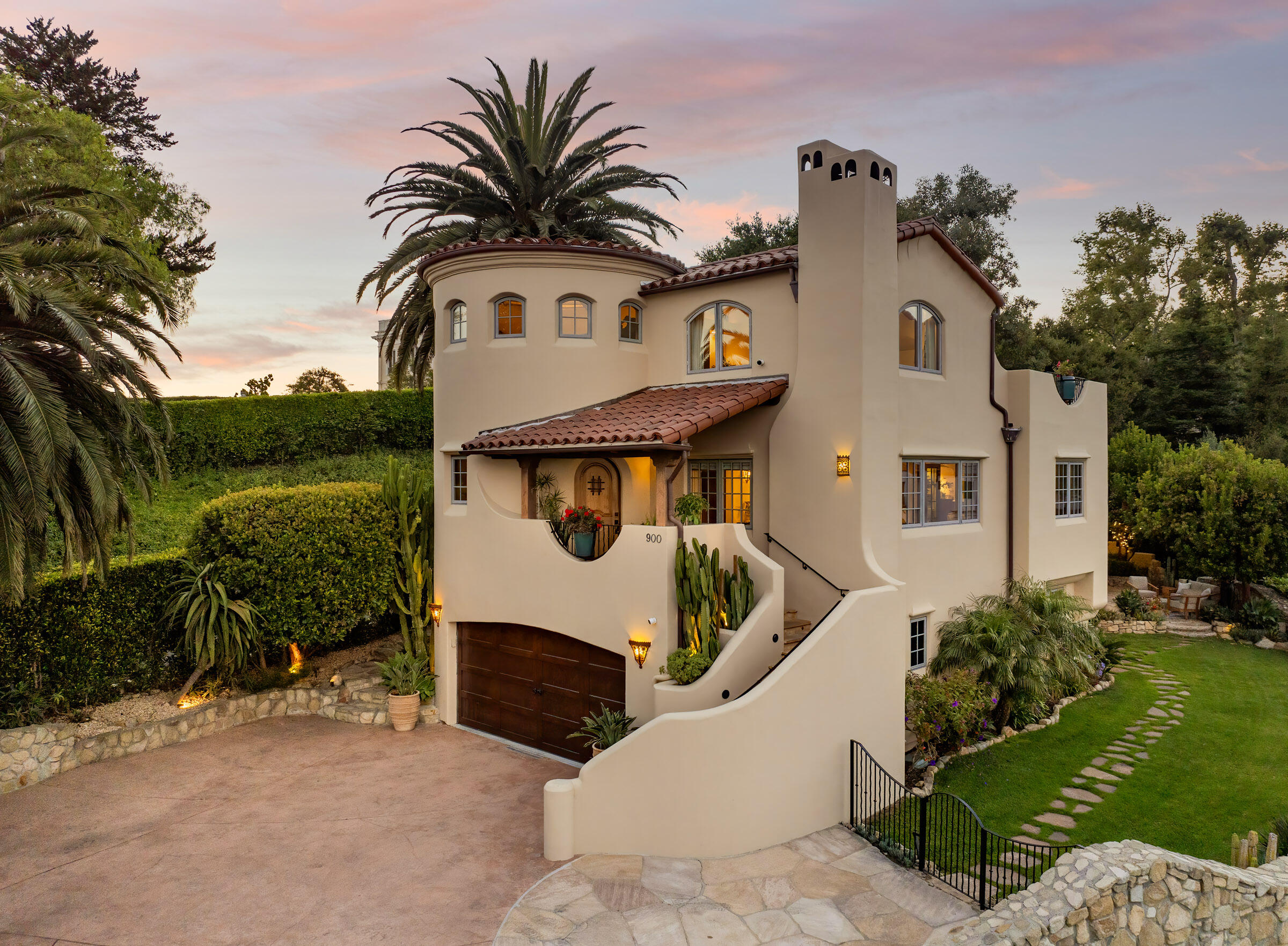 900 Las Alturas Road Santa Barbara, CA 93103 - Photo 42 of 42 a view of a white house with a yard and potted plants
