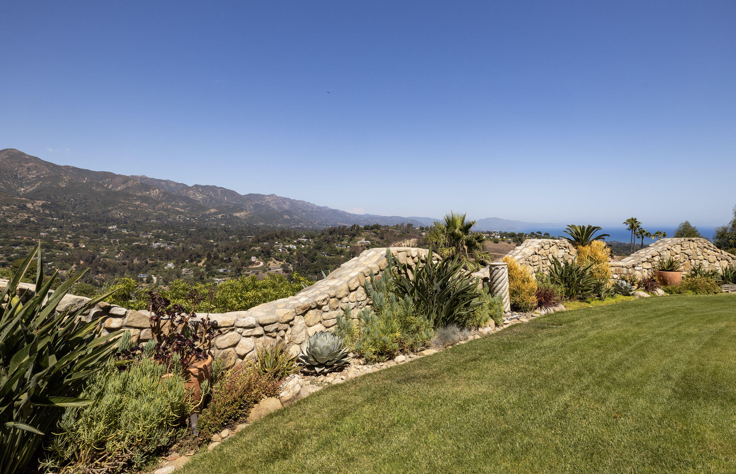 900 Las Alturas Road Santa Barbara, CA 93103 - Photo 5 of 42 a view of a lake with mountains in the background