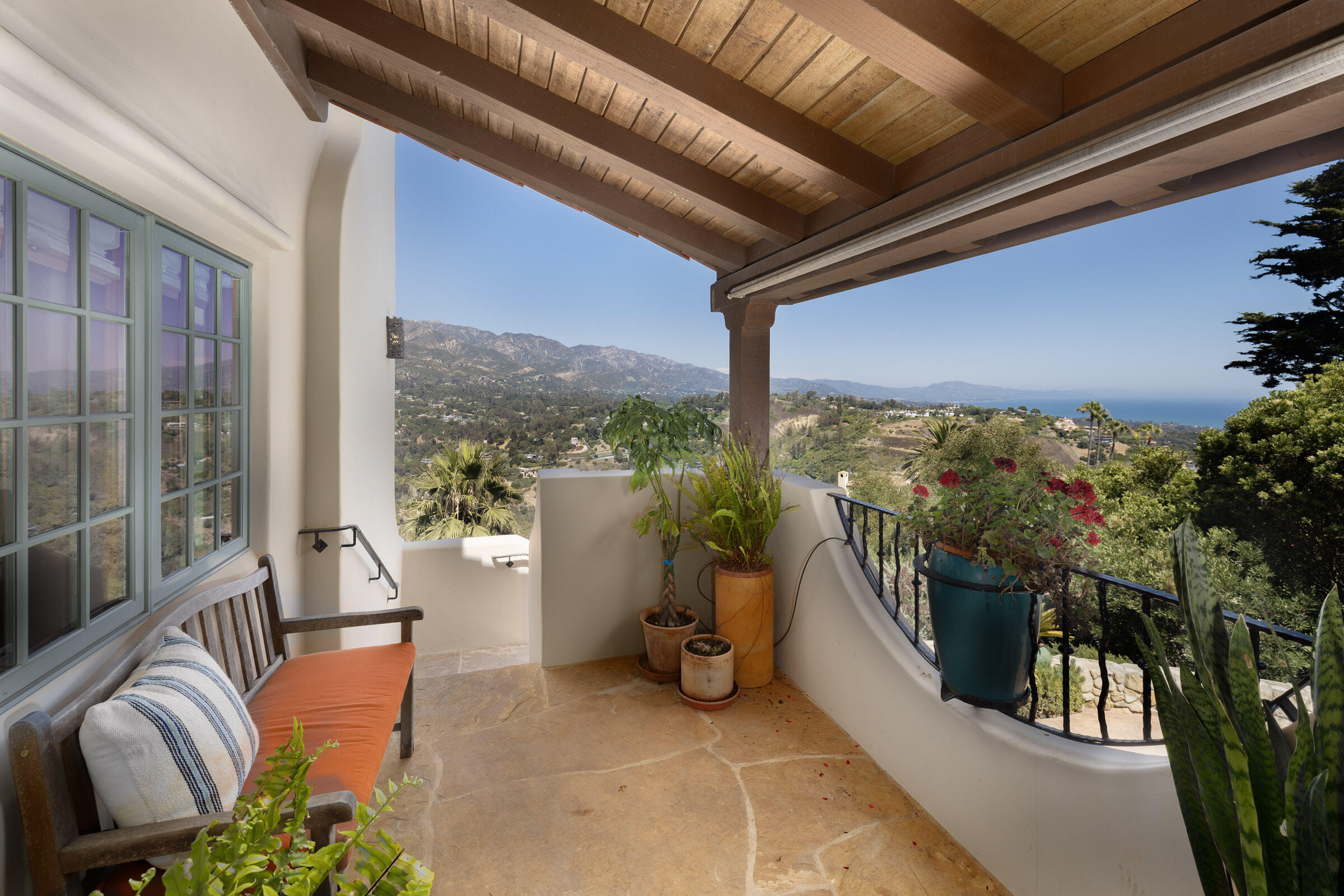 900 Las Alturas Road Santa Barbara, CA 93103 - Photo 8 of 42 a balcony with furniture and a potted plant