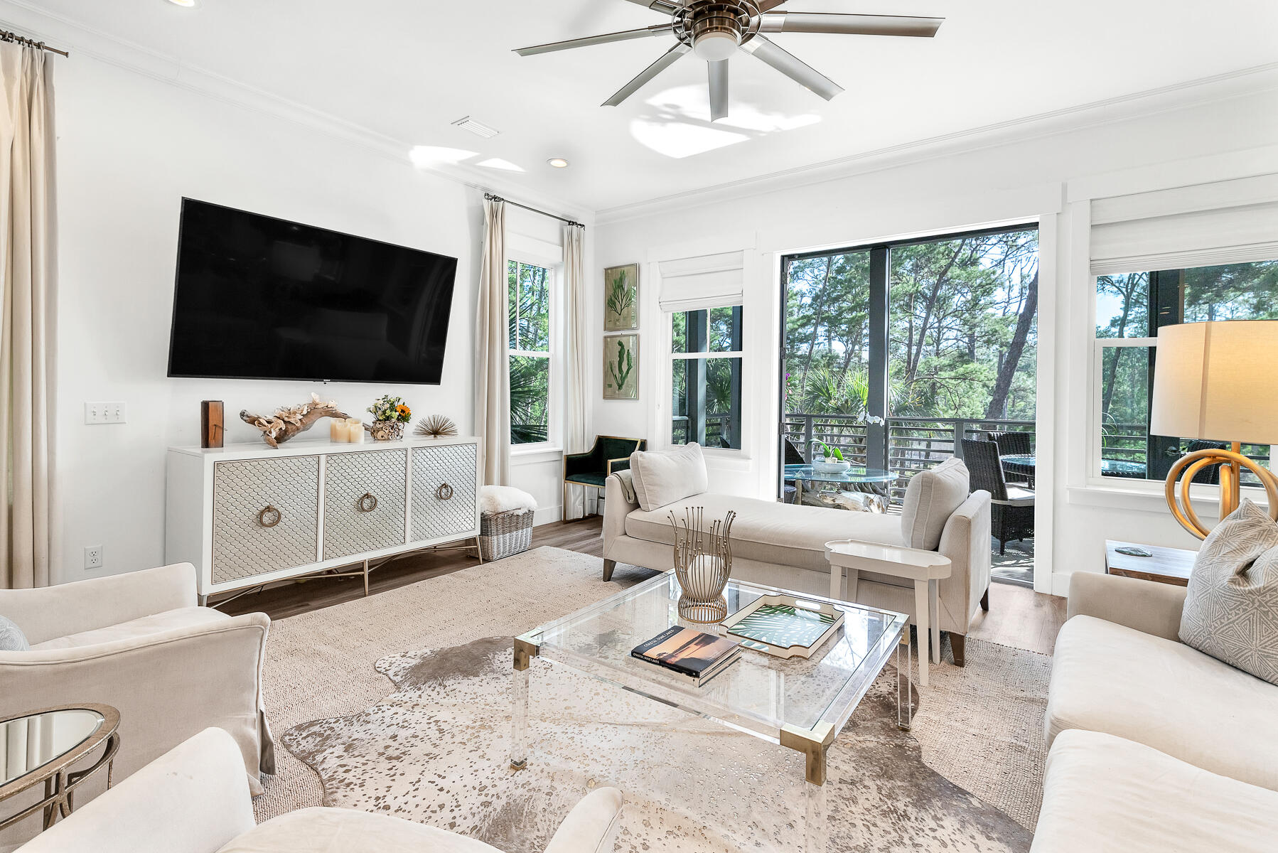 363 Matt's Way Santa Rosa Beach, FL 32459 - Photo 6 of 51 a living room with furniture a flat screen tv and a large window