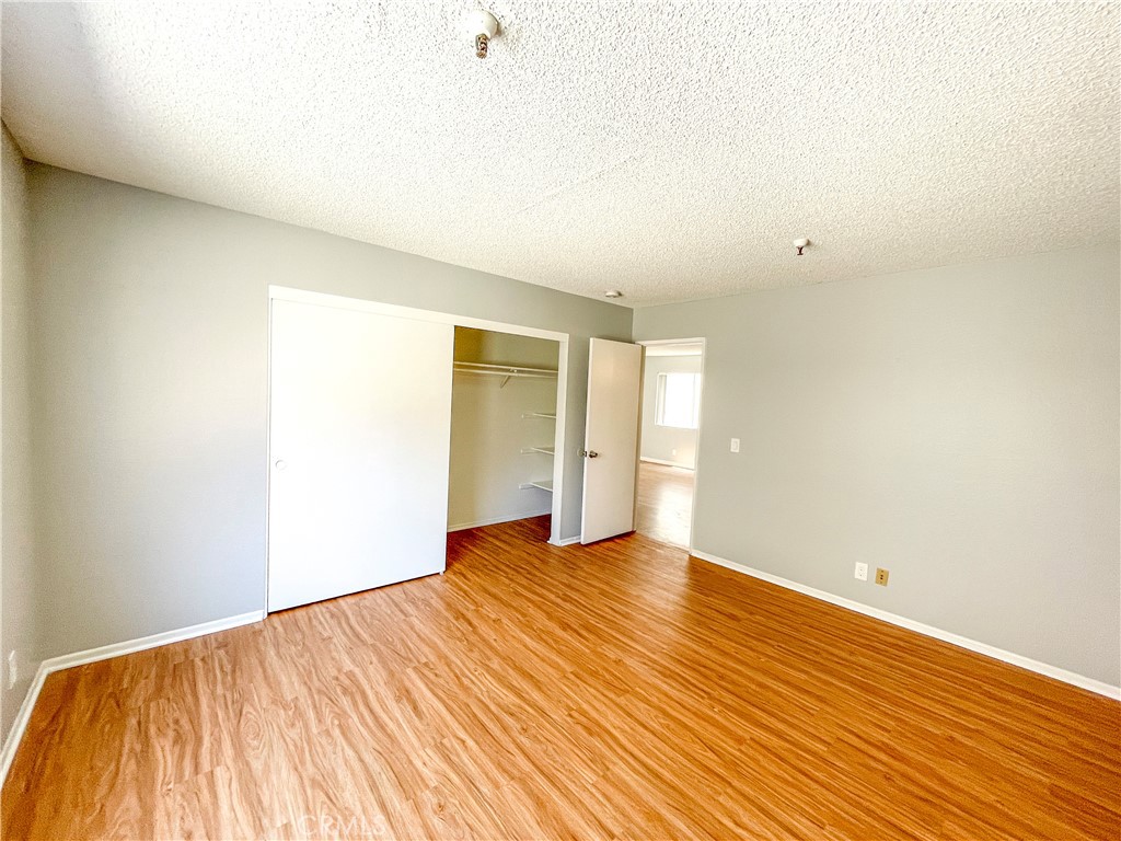 13535 Yukon Avenue, Unit 28 Hawthorne, CA 90250 - Photo 5 of 11 a view of an empty room with wooden floor