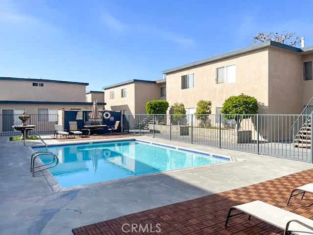 a view of a kitchen with kitchen island and a stove