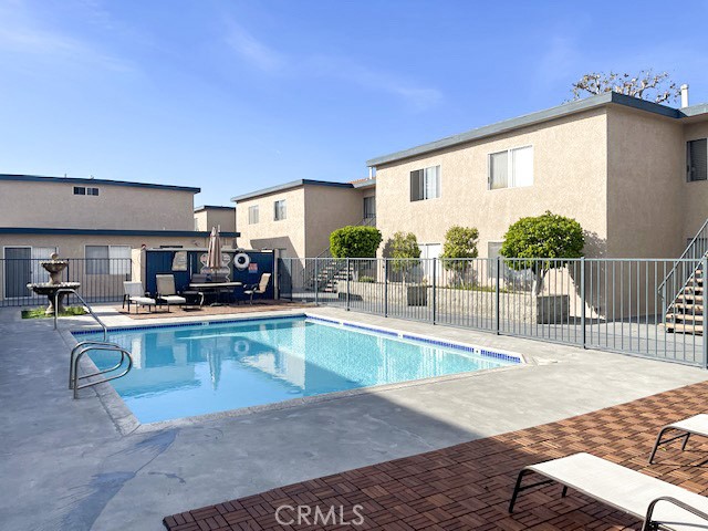 13535 Yukon Avenue, Unit 28 Hawthorne, CA 90250 - Photo 9 of 11 a view of a kitchen with kitchen island and a stove