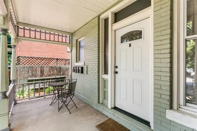 a view of a dinning room with a table and chairs