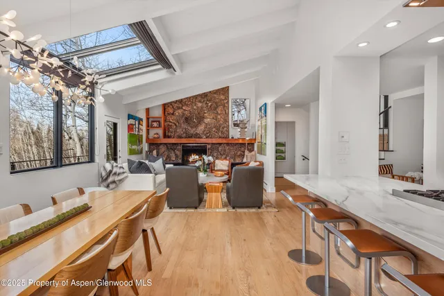 a bathroom with a granite countertop sink mirror and a toilet