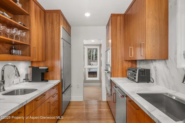a bathroom with a tub sink toilet and a mirror