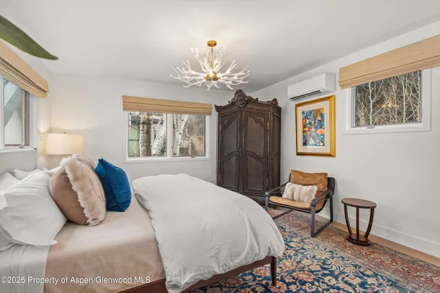 a bathroom with a granite countertop sink mirror and shower