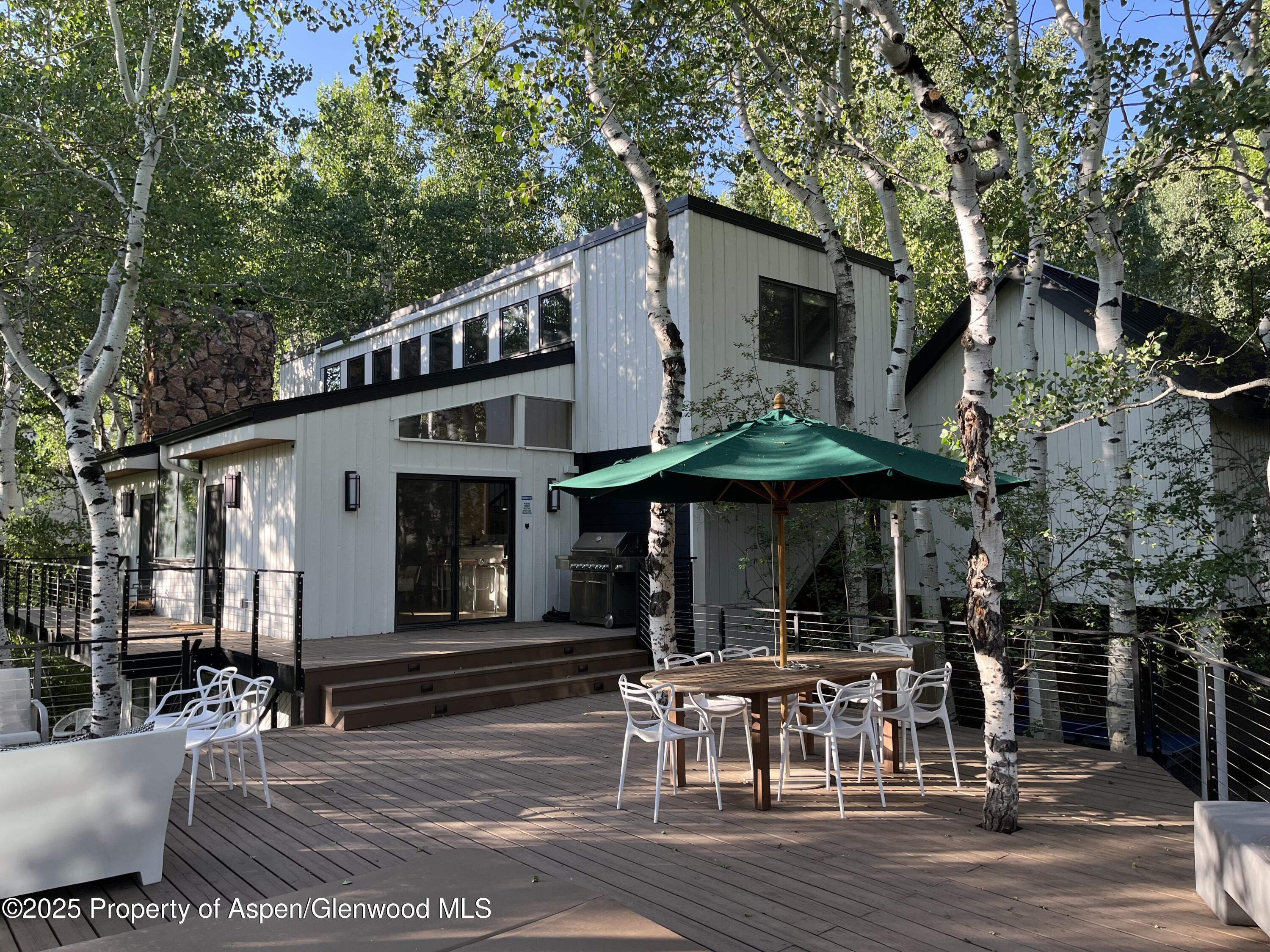 262 Eastwood Road Aspen, CO 81611 - Photo 3 of 46 a view of a cafe with a couple of people seating on table and chairs