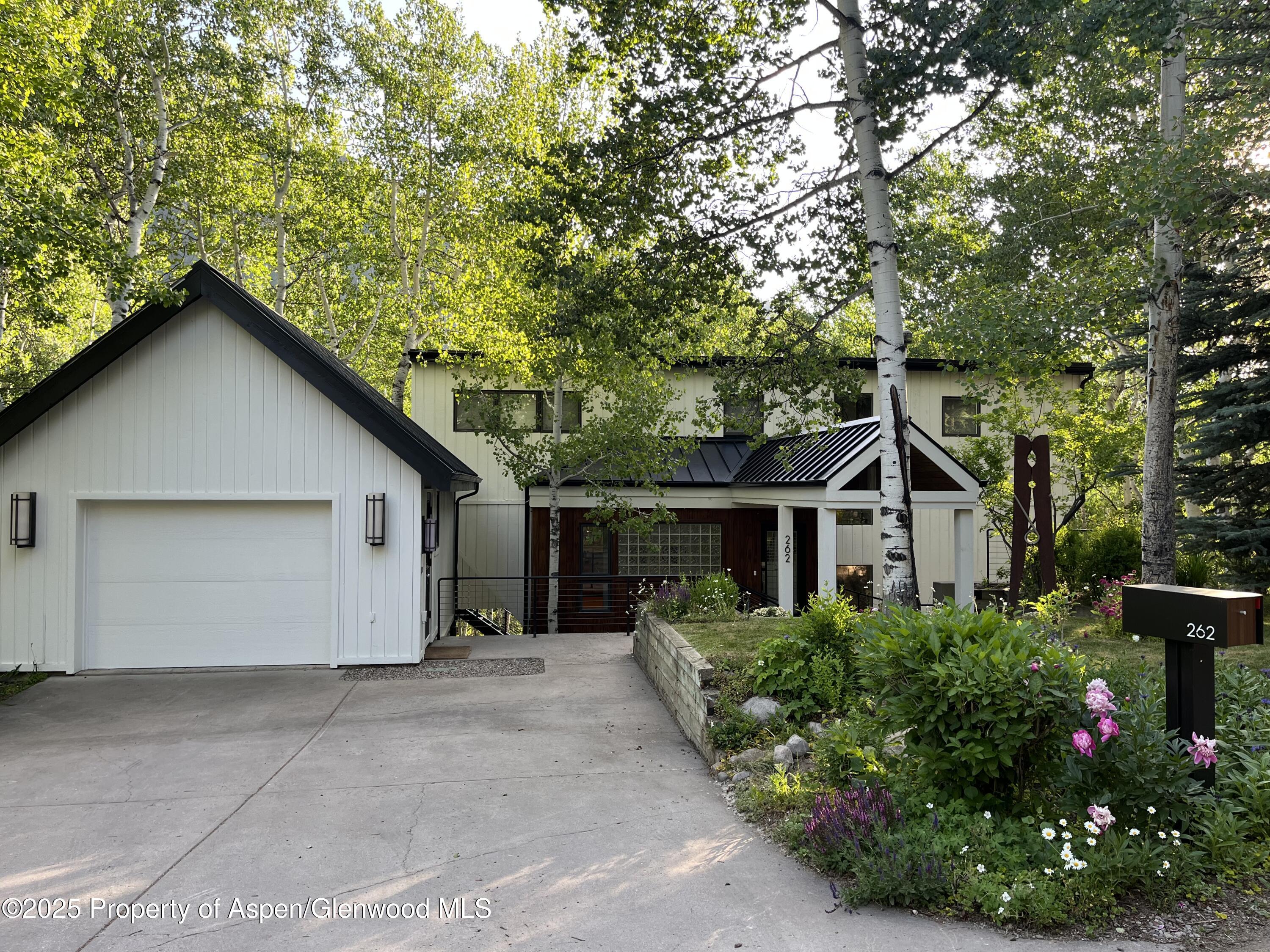 262 Eastwood Road Aspen, CO 81611 - Photo 43 of 46 a house with trees in the background