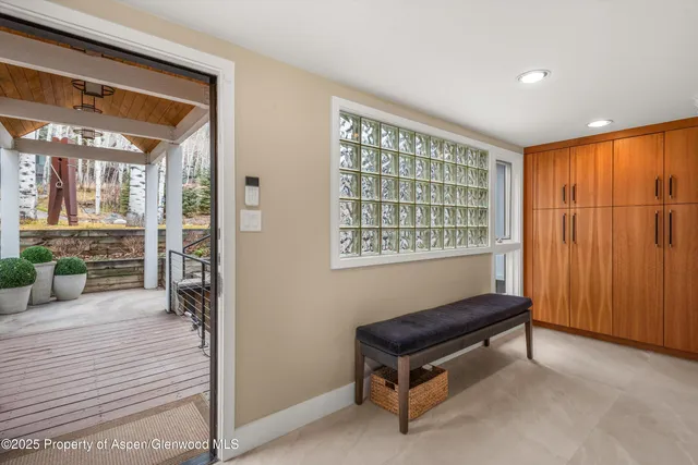 a living room with furniture a table and a fireplace