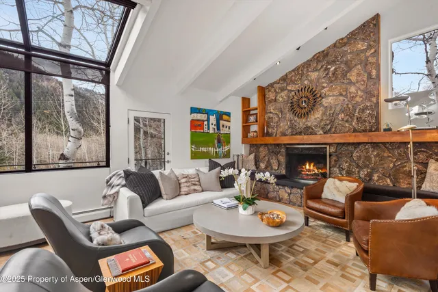 a living room with furniture and a table