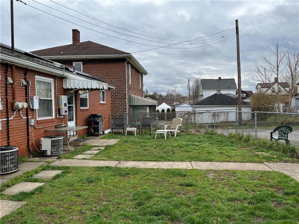 613-615 Bank Street Carnegie, PA 15106 - Photo 22 of 25 a backyard of a house with table and chairs