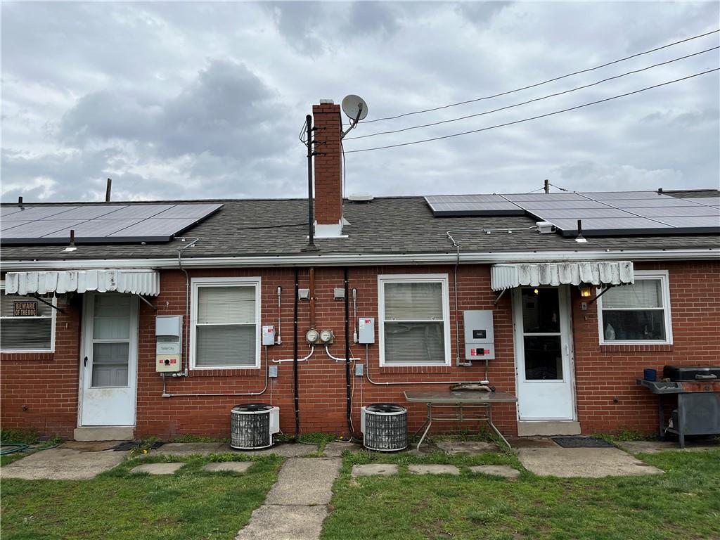 613-615 Bank Street Carnegie, PA 15106 - Photo 24 of 25 a front view of a house with a garden