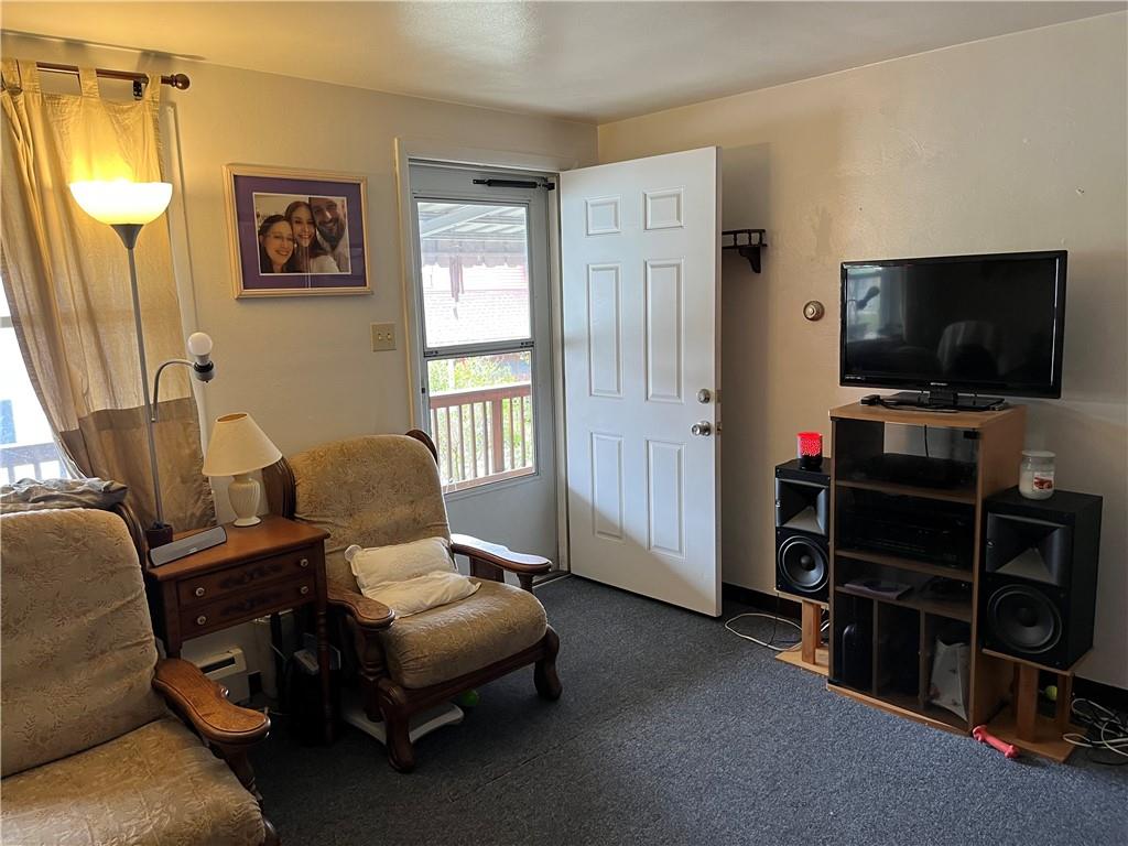 613-615 Bank Street Carnegie, PA 15106 - Photo 3 of 25 a living room with furniture and a flat screen tv