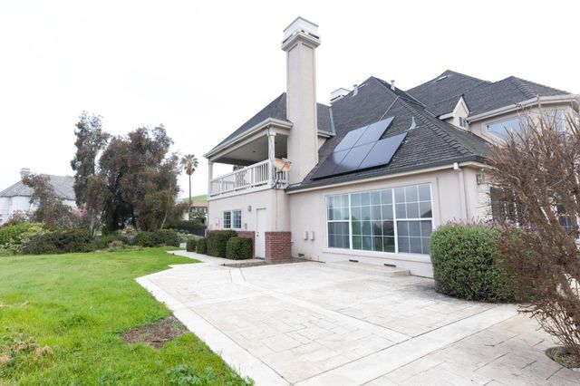 a kitchen with stainless steel appliances a stove a microwave and sink