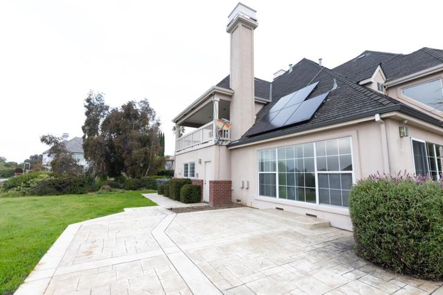 a kitchen with stainless steel appliances a stove sink and cabinets