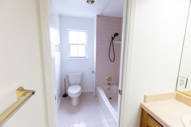 a view of a house with a yard covered in snow