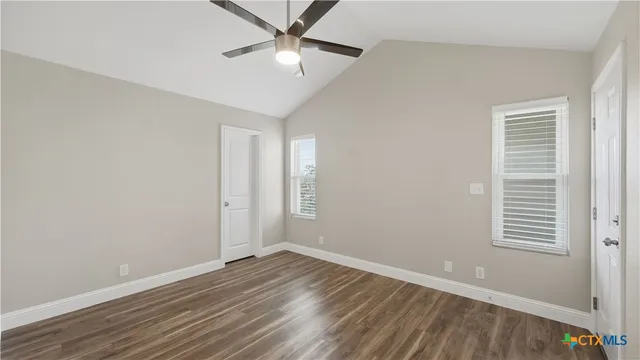 an aerial view of multiple houses with yard